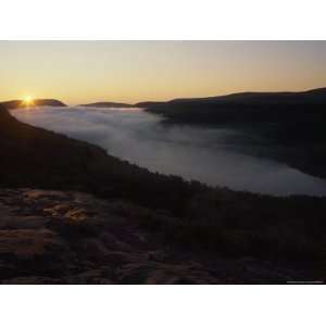 Sun Peeks over the Horizon at Lake of the Clouds in Michigans Upper 