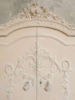 Fabulous chic vintage armoire with wedding cake carvings along the 
