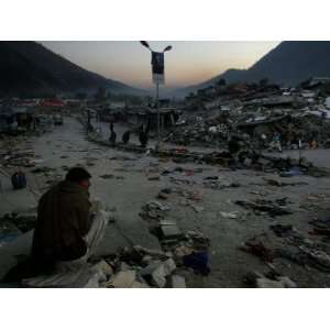  A Homeless Pakistani Earthquake Survivor Sits on the 