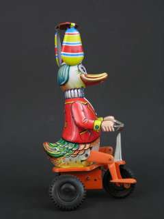 Vintage Tin Wind Up Duck on Bicycle Twirling Hat Made in Western 
