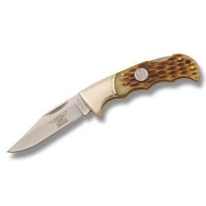   Knife with Finger Grooved Amber Jigged Bone Handles