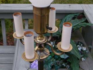 TAKES 4 REGULAR TYPE BULBS ON THE CANDLESTICKS AND ONE REGULAR SIZE 