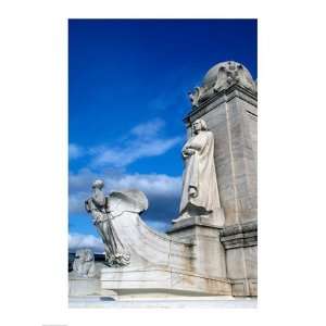  Statue of Christopher Columbus in front of railroad 