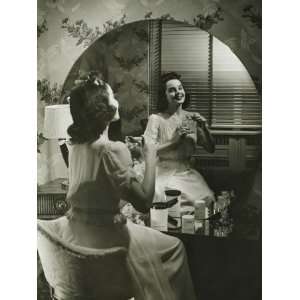  Young Woman Applying Cream in Front of Mirror Photographic 