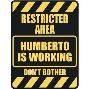   RESTRICTED AREA HUMBERTO IS WORKING  PARKING SIGN