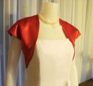   COLORED BOLERO JACKETS AS WELL AS MANY DIFFERENT STOLES, WRAPS, SCARFS