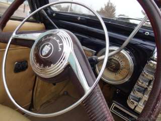 open the door to 1946 the interior features brown leather upholstery
