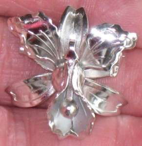 THIS IS A CUTE SILVERTONE ORCHID PIN, IT MEASURES APPROX. 1 IN. & IS 