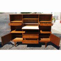   holds shelves and a drop down cabinet door with interior shelf 2