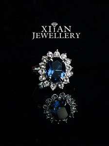  Diana Engagement Ring, Sapphire Surround By 14 Smaller Diamonds  