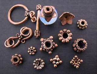 Ornate solid Copper spacer beads with a semi antique finish & center 