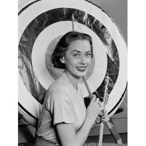  Woman Holding Bow and Arrows, Target in Background 