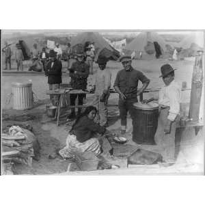  Mexican men,woman assisting Army cook at U.S. Army tent 