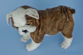 elaborate folds and his padded paws feature needle felted toenails