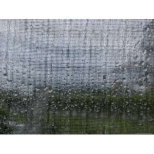  Looking Through a Window and Screen to the Rain Outside 